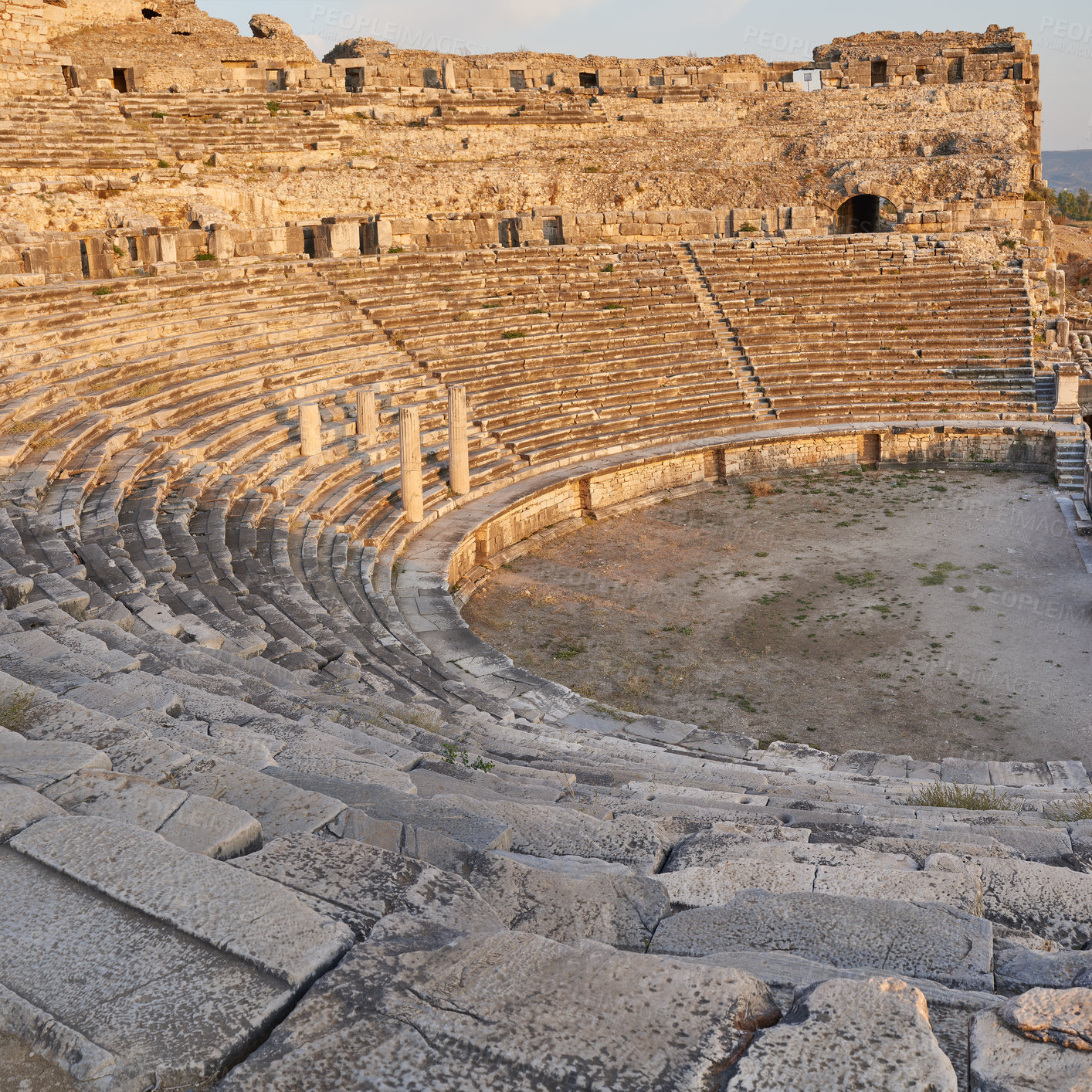 Buy stock photo Archeology, ruins and forum from building exterior stage for travel destination, sightseeing and historical monument. Medieval, brick and colosseum architecture in Middle east for tourism or landmark