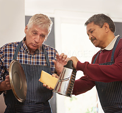 Buy stock photo Senior man, chef and teaching with cheese in kitchen for learning, culinary class or dairy at old age home. Male person, friends or hospitality team with ingredients, apron or special recipe at house