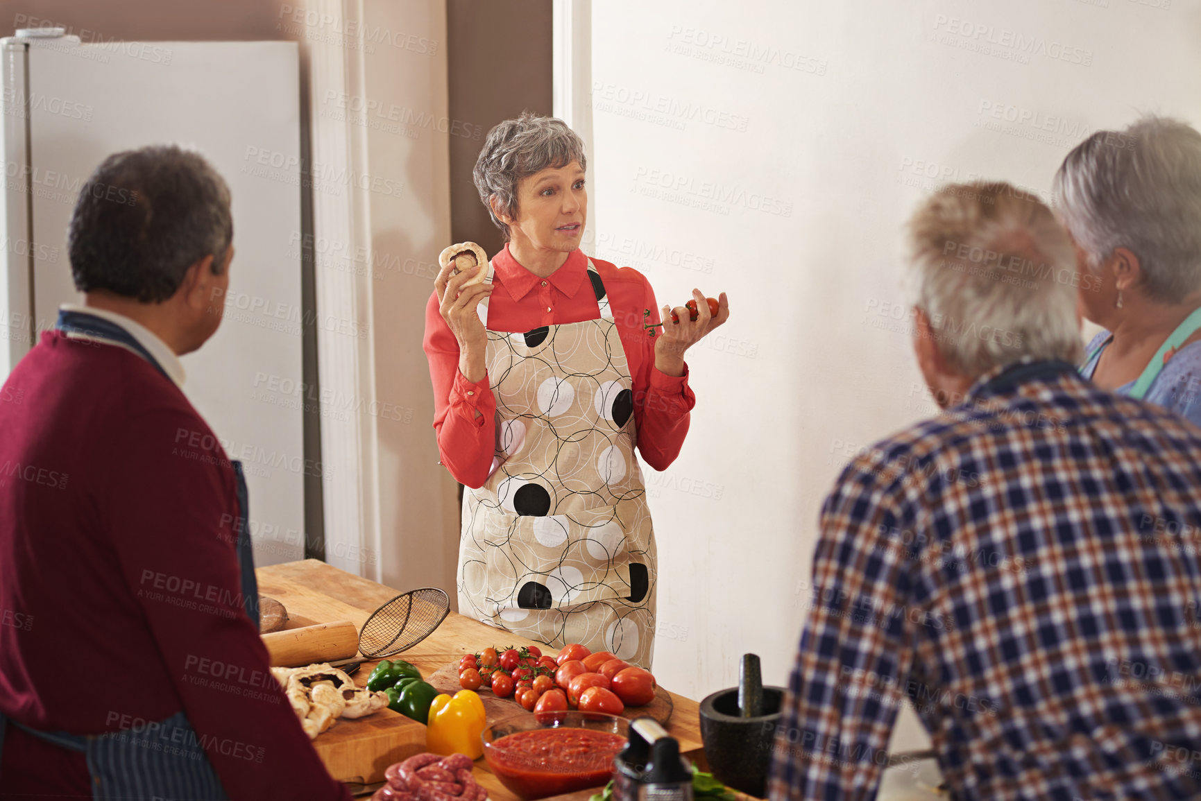 Buy stock photo Shot of a woman instructing a cooking class