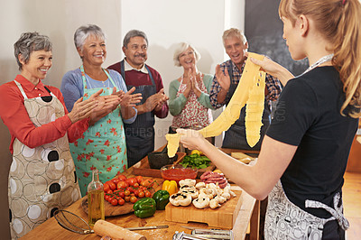 Buy stock photo Cooking, pasta and chef with people in kitchen learning recipe for cuisine, culinary and baking skills. Retirement, teacher and and men and women with pastry ingredients, dough and food for dinner