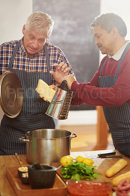 Buy stock photo Senior man, teaching and cooking with pot for cheese or diary dish in kitchen together at old age home. Male person or team learning in hospitality with mixing ingredients, food or recipe at house