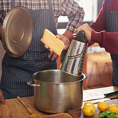 Buy stock photo Person, hands and cooking with pot for cheese or diary dish in kitchen or secret recipe together at home. Closeup of friends, team or people in hospitality or mixing ingredients with apron at house