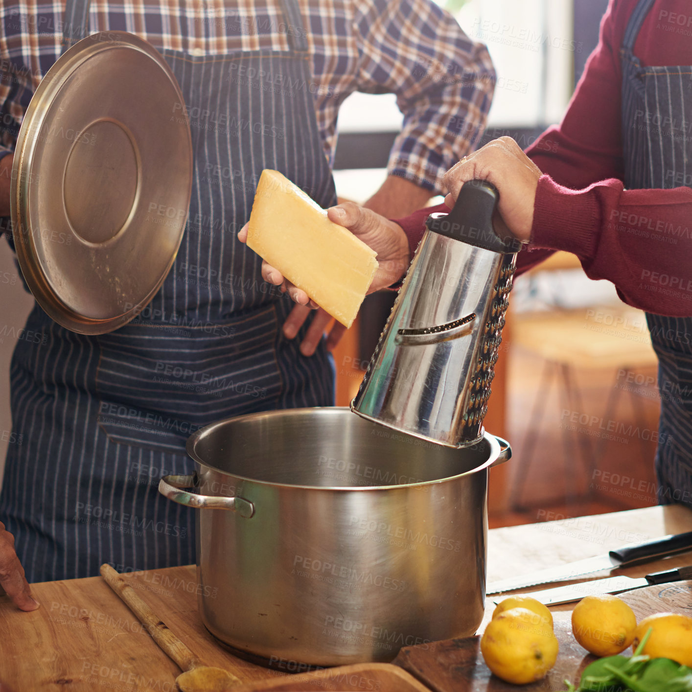 Buy stock photo Person, hands and cooking with pot for cheese or diary dish in kitchen or secret recipe together at home. Closeup of friends, team or people in hospitality or mixing ingredients with apron at house