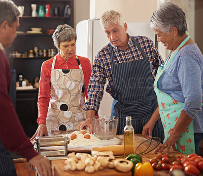 Buy stock photo Cooking, friends and senior people in kitchen with recipe for bonding, talk and conversation in home. Culinary, retirement and men and women with ingredients, vegetables and meal for dinner together