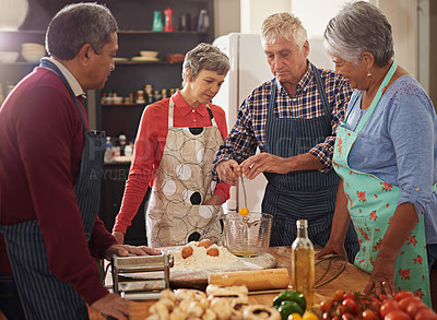 Buy stock photo Cooking, food and senior friends in kitchen with recipe for bonding, talking and conversation in home. Culinary, retirement and men and women with ingredients, vegetables and meal for dinner together