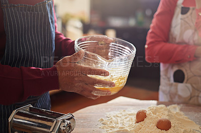 Buy stock photo Cropped shot of two people baking in the kitchen