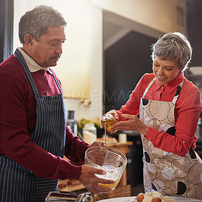 Buy stock photo Food, cooking and senior couple in kitchen for fun, bonding or meal prep for love, care or help in a house. Diet, nutrition and old people with olive oil, support or assistance for Italian recipe