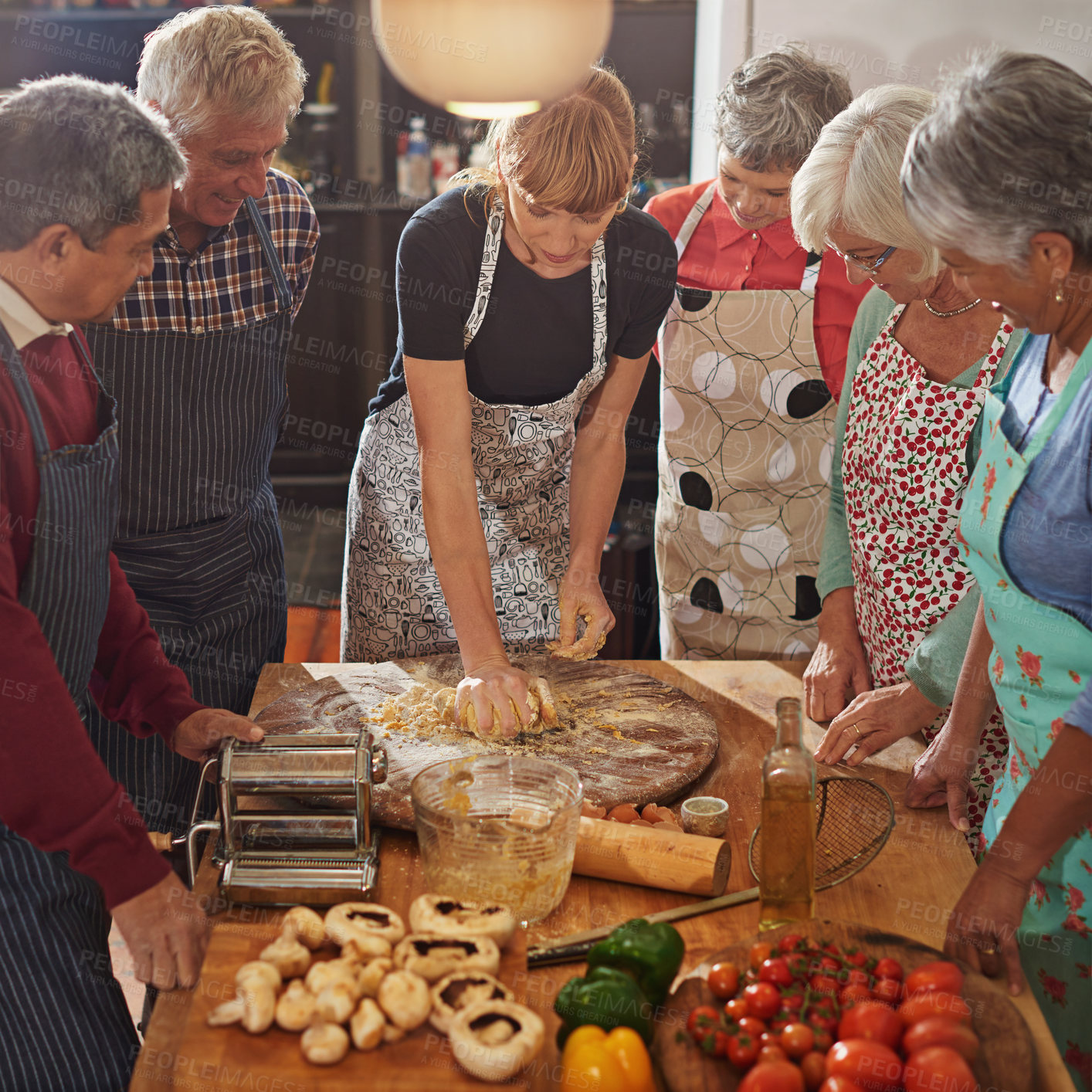 Buy stock photo Cooking class, food and old people with chef in kitchen for nutrition, diet or easy recipe in retirement. Nursing home, learning and nutritionist volunteer show senior group traditional pasta meal