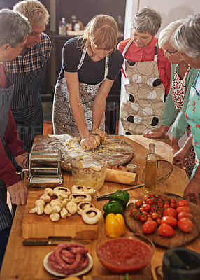 Buy stock photo Shot of a group of seniors attending a cooking class