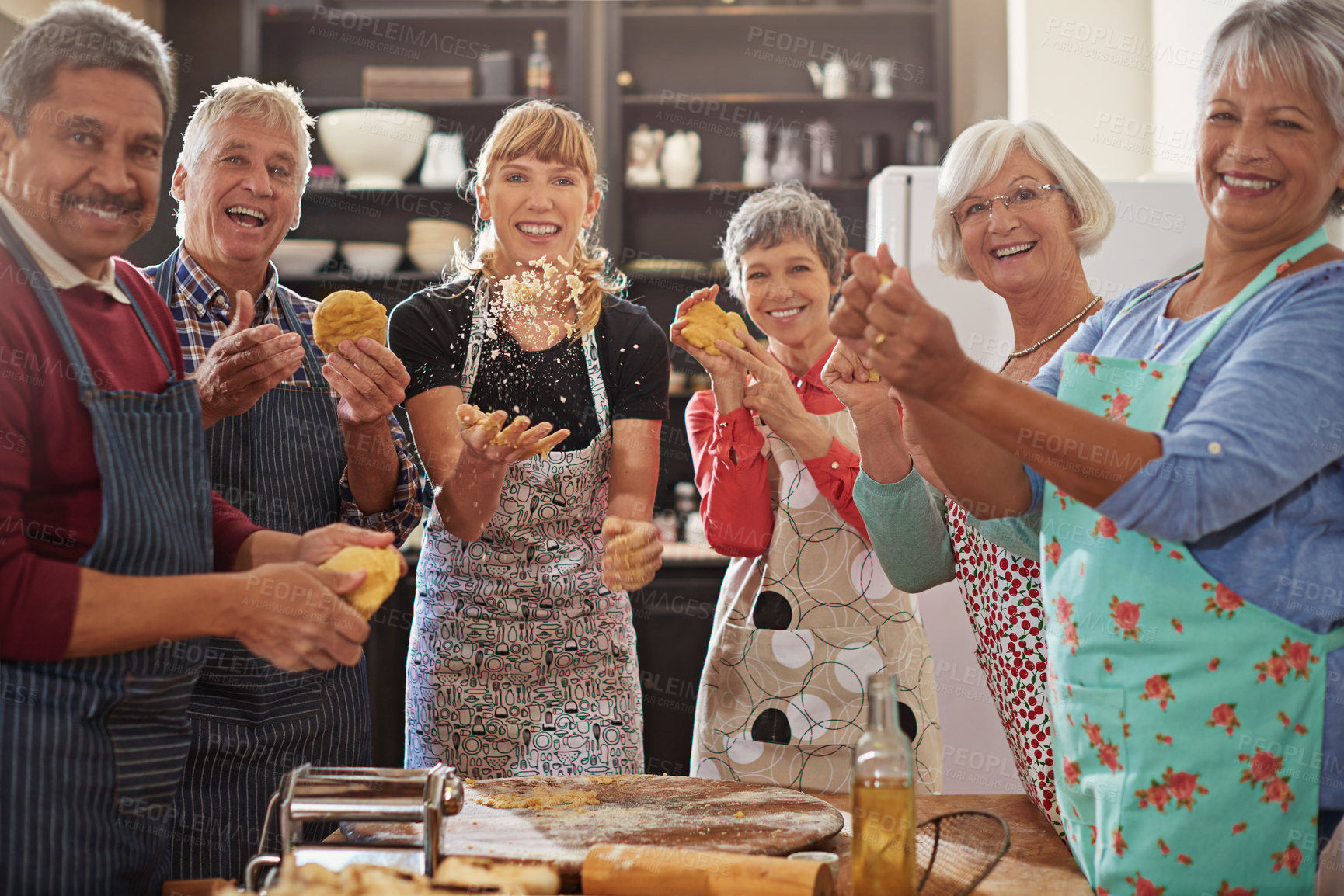 Buy stock photo Portrait, happy senior people having fun kitchen and at cooking class. Achievement or success, baking or cooking collaboration and teamwork of elderly group cheering or celebrating together