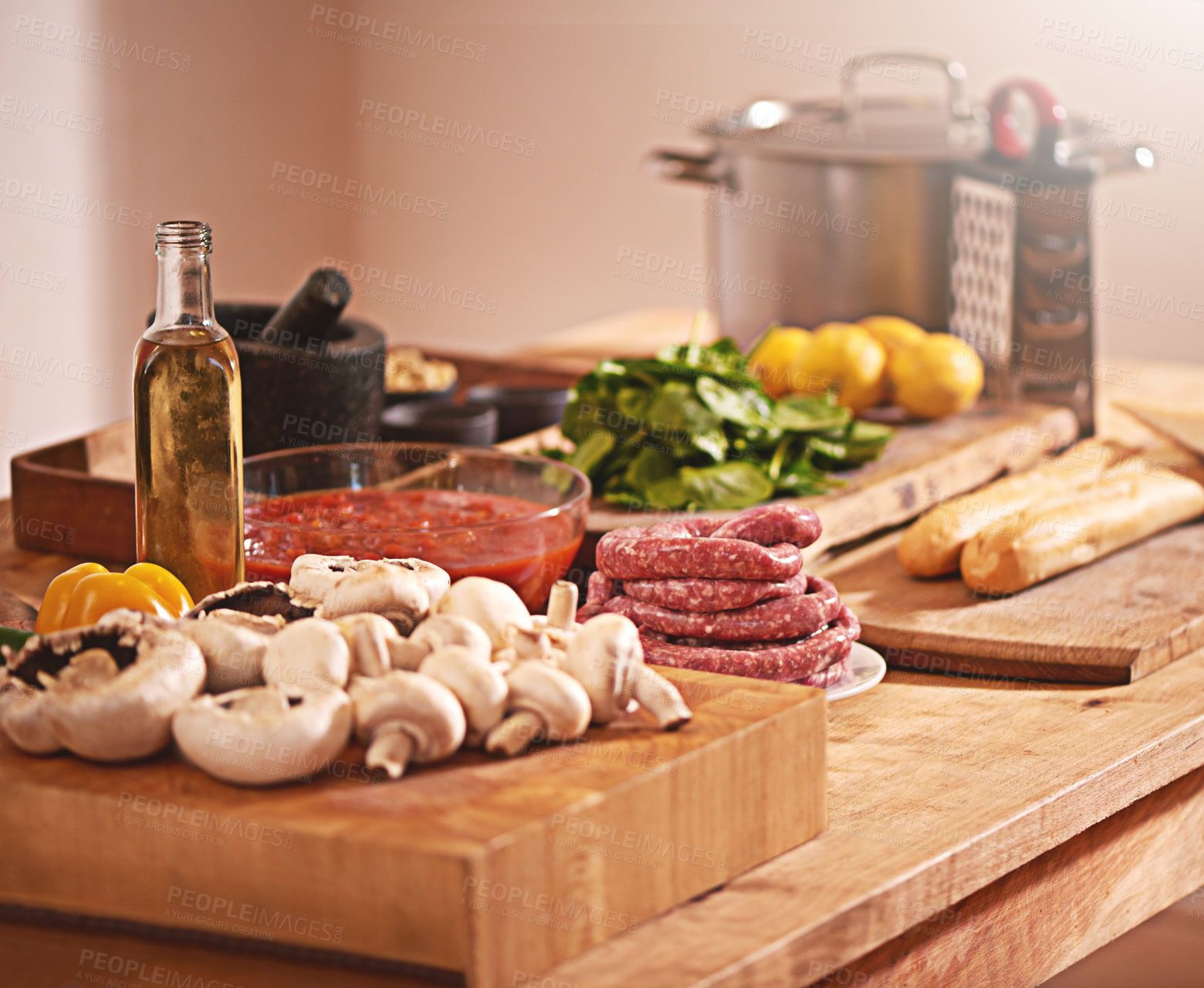 Buy stock photo Cooking, Italian food and vegetables in kitchen on table for meal prep for dinner, supper and lunch in home. Recipe, diet and utensils on counter with ingredients for pasta, nutrition and cuisine