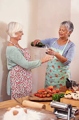Buy stock photo Wine, food and happy senior women in home for toast to lunch, supper and dinner together with friends. Alcohol, cooking and mature people with drink, bottle and glass for celebration, party and event