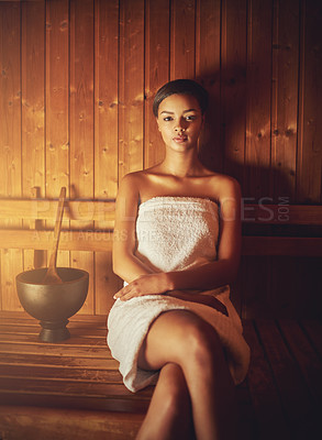 Buy stock photo Cropped portrait of a young woman relaxing in the sauna at a spa