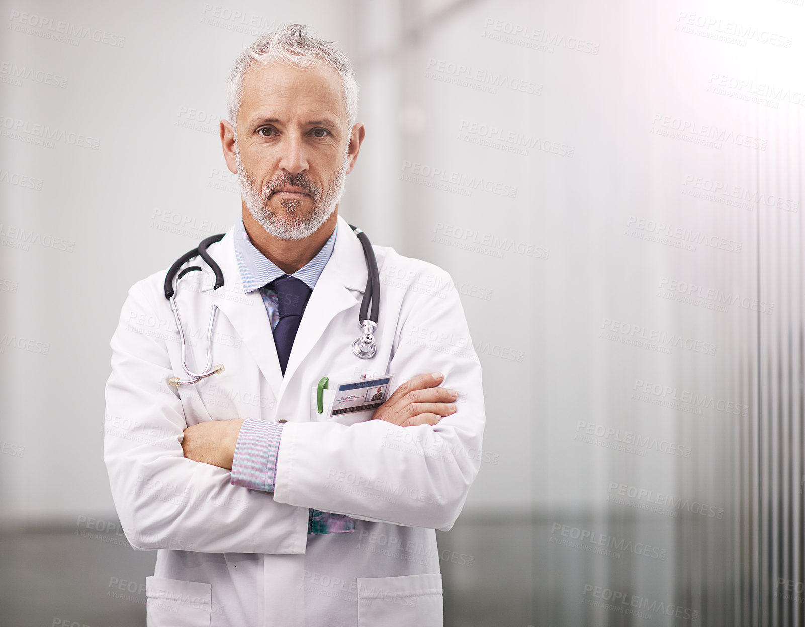 Buy stock photo Doctor, healthcare and portrait of a serious man in a hospital with mockup space for health insurance. Professional male medical worker with a stethoscope for a consultation, healing and wellness