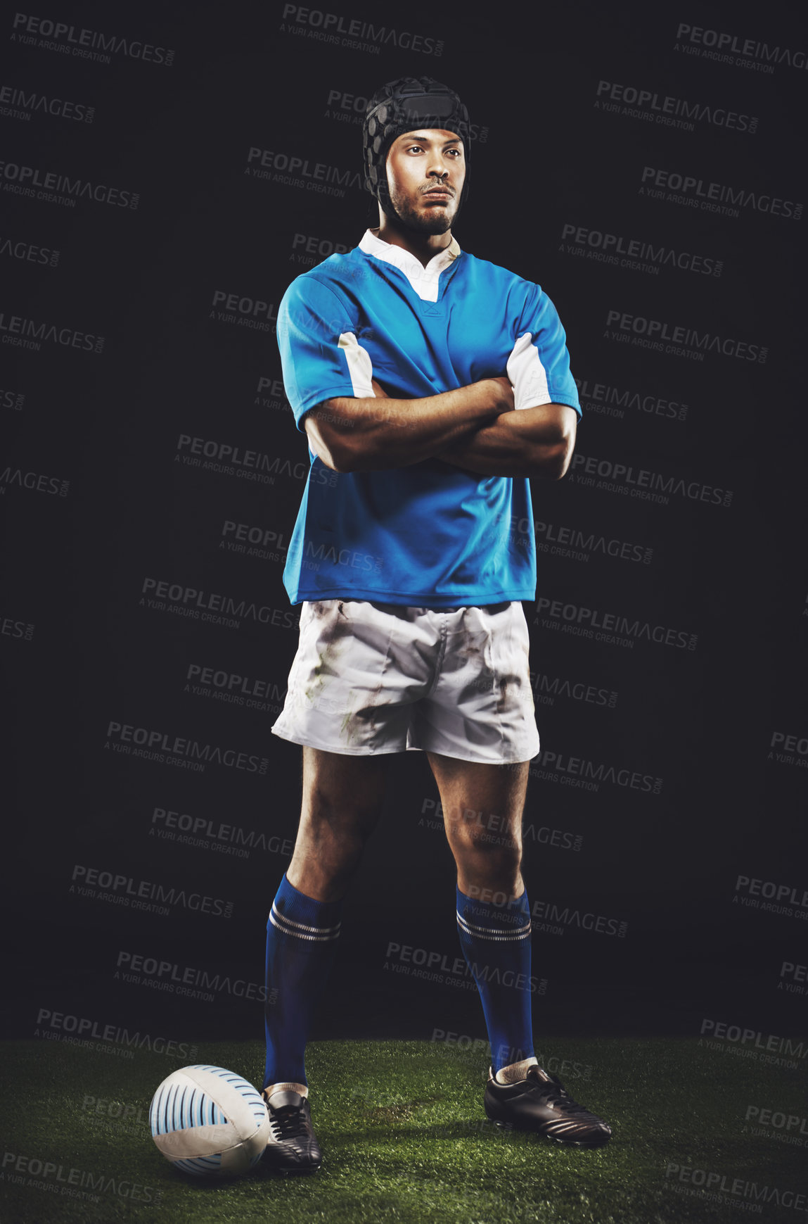 Buy stock photo Studio, night and rugby man with arms crossed for competition, training or sportswear on dark background. Confident, athlete and person by ball for professional sport, workout or exercise on grass
