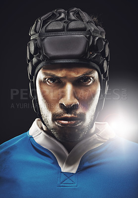 Buy stock photo Cropped studio portrait of a determined young rugby player