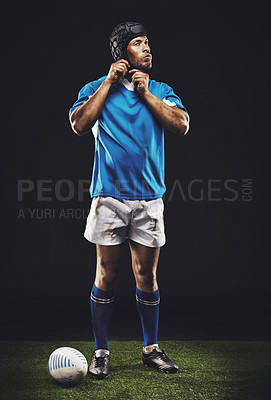Buy stock photo Rugby, night and background man getting ready for training, competition or sportswear in dark studio. Athlete, ball and young male person with confidence for professional sport, exercise or workout