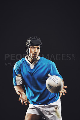 Buy stock photo Catch, man and ball for rugby sport or training for match, fitness and focused for competition. Person or player on serious with skill for practice or active for football game on black background