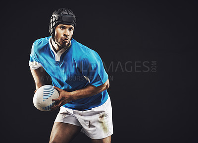Buy stock photo Black background, rugby and man in action with ball for training, workout and competition for sports with mockup space. Studio, male person or professional athlete and exercise for football game.