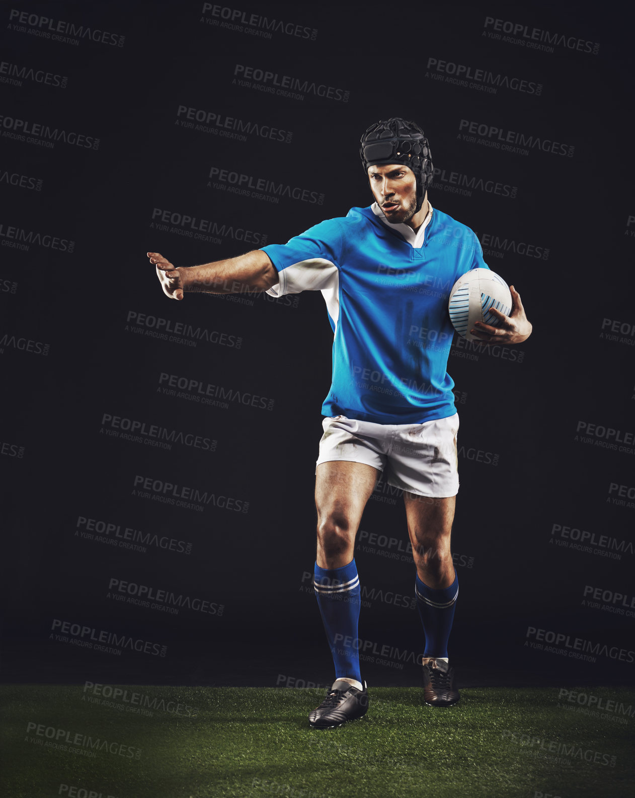 Buy stock photo Defend, man and ball for rugby sport or training for workout, fitness and skill for competition. Person or player on grass and athlete stop with hand or active for football game on black background.