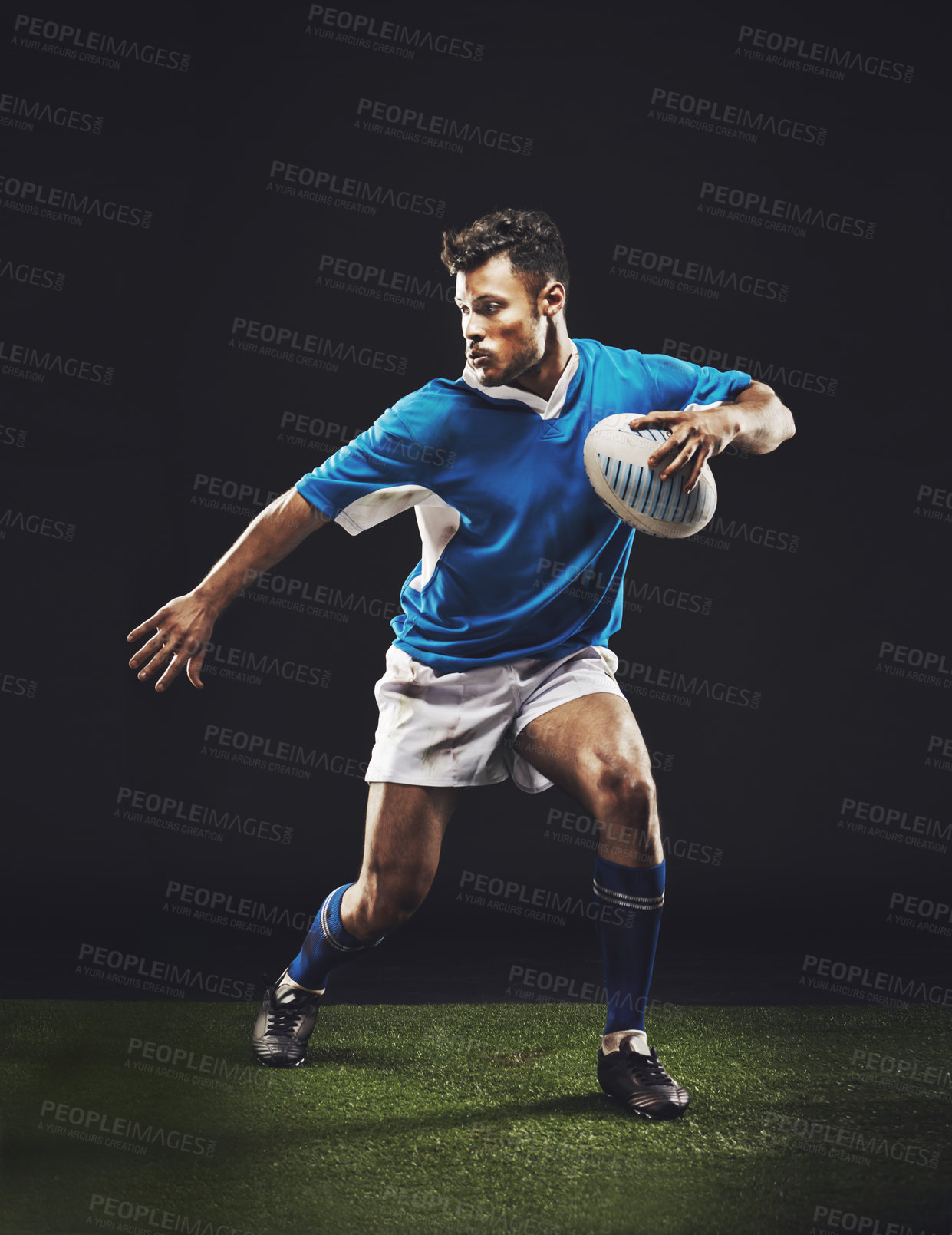 Buy stock photo Rugby, black background and man athlete running in dark studio while training, wellness and fitness sports. Exercise, workout and professional career of sport male person or player on grass