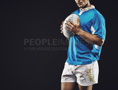 Buy stock photo Black background, man and ball for rugby sport, closeup and mockup space, sportswear and professional for workout. Male person or player, fitness and athlete for football game or match and strong