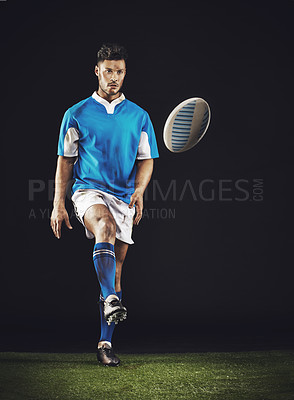Buy stock photo Full length studio shot of a young rugby player on the field