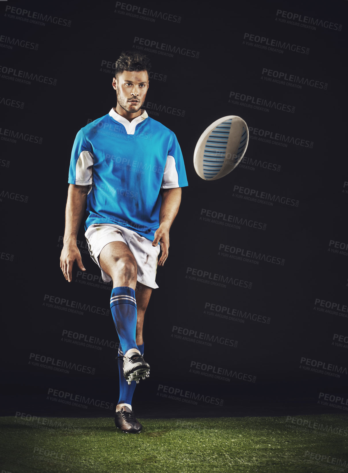 Buy stock photo Full length studio shot of a young rugby player on the field