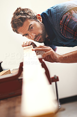 Buy stock photo Carpenter, wood and planning with man in workshop for building, manufacturing and creative. Design, industry and woodworker with handyman measuring on workbench for builder, lumber and maintenance