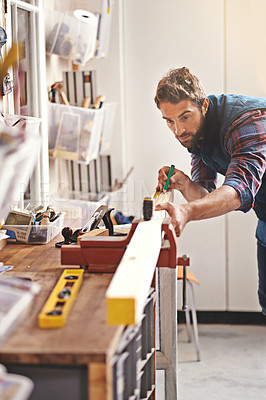 Buy stock photo Man, workshop and tape measure for construction, home development and building renovation. Carpenter, maintenance employee and male repairman worker on a contractor job of builder working in house