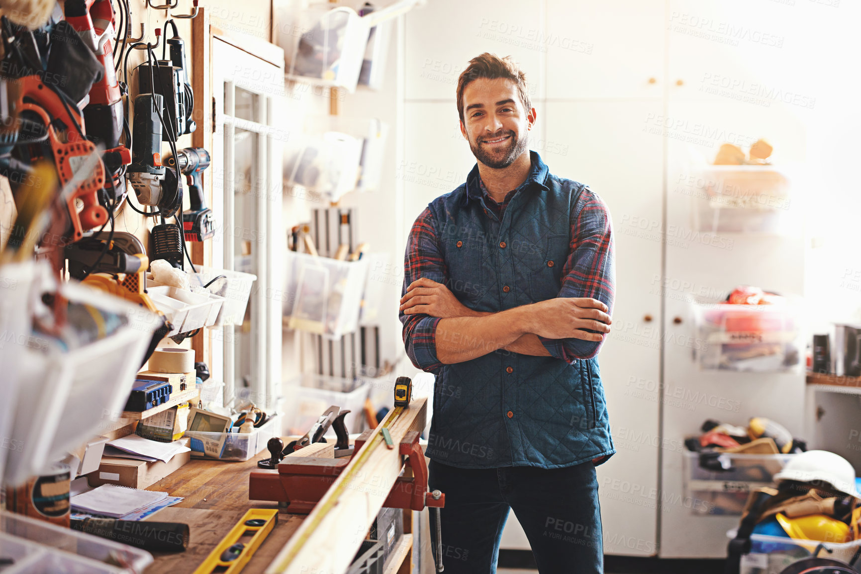 Buy stock photo Tools, smile and portrait of man in workshop for furniture, manufacturing and small business production. Male person, happy and handyman with equipment for renovation, maintenance or remodeling