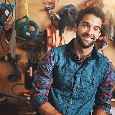 Buy stock photo Tools, carpenter and portrait of man in workshop for home development, construction and renovation. Confidence, contractor and male employee for maintenance, repair work and smiling in garage