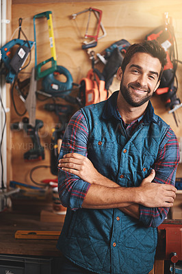 Buy stock photo Tools, portrait and man with arms crossed in workshop for diy, home development or renovation. Handyman, carpenter and happy male employee for maintenance, equipment and repair work for construction