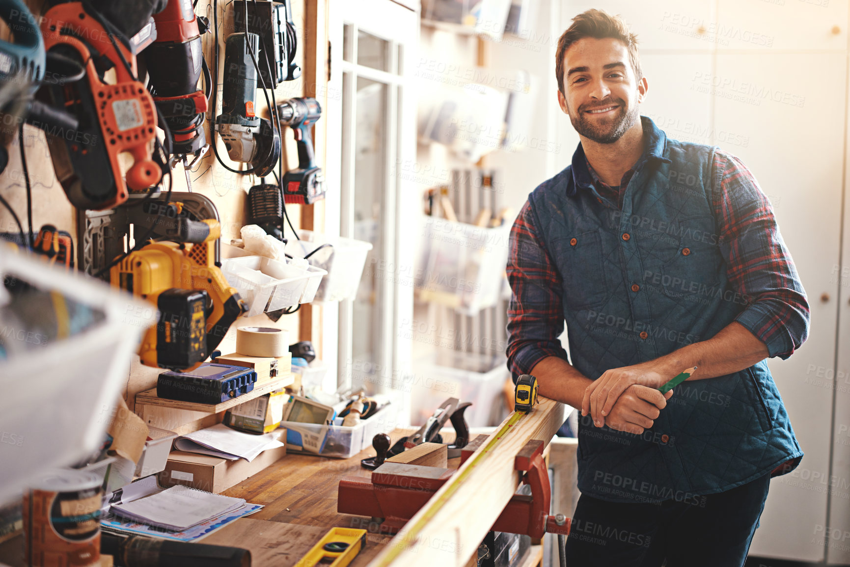 Buy stock photo Carpenter, wood and portrait of happy man in workshop for home development, diy tools and building renovation. Smiling, male employee and contractor for maintenance, equipment and repair work