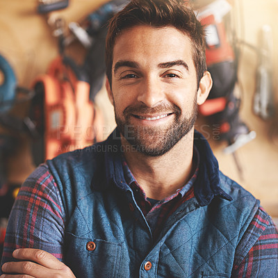 Buy stock photo Handyman, tools and portrait of man for carpentry, home development or building renovation in garage. Construction, lens flare and male employee for diy maintenance, equipment or repair work
