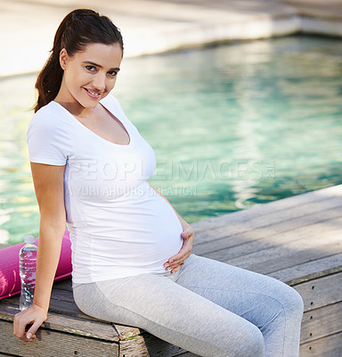 Buy stock photo Shot of a young pregnant woman sitting with her yoga mat outside
