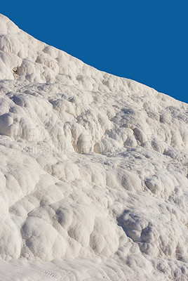 Buy stock photo Scenic view of travertine pools and terraces in Pamukkale, Turkey. Traveling abroad, overseas for vacation and tourism. Cotton castle area with carbonate mineral after flowing thermal spring water