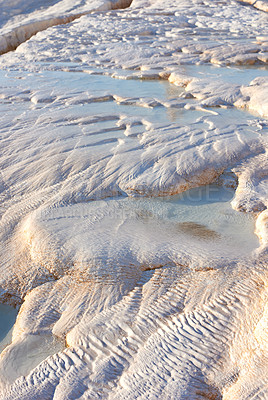 Buy stock photo Closeup of travertine pools and terraces in Pamukkale, Turkey. Travelling abroad, overseas for holiday, vacation, tourism. Cotton castle area with carbonate mineral after flowing thermal spring water