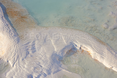 Buy stock photo View of travertine pools and terraces in Pamukkale Turkey. Traveling abroad, overseas for vacation and tourism. Cotton castle area with carbonate mineral after flowing thermal spring water from above