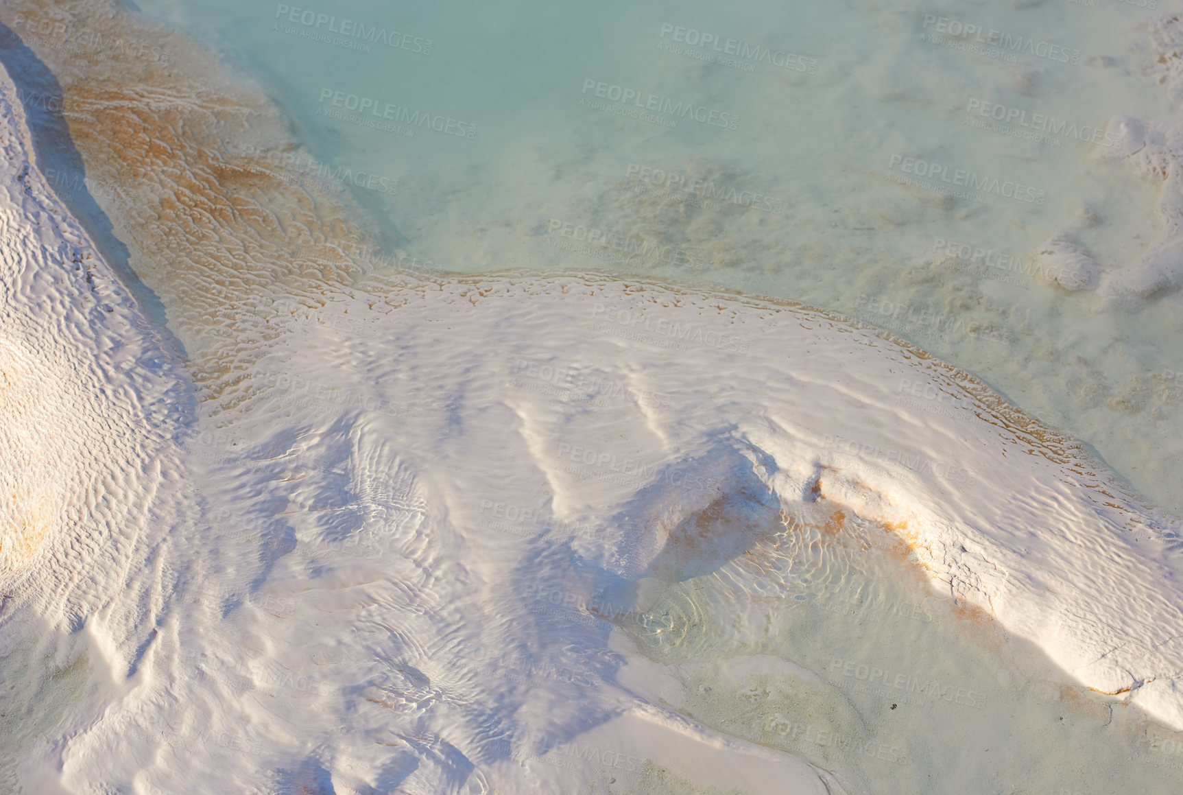 Buy stock photo View of travertine pools and terraces in Pamukkale Turkey. Traveling abroad, overseas for vacation and tourism. Cotton castle area with carbonate mineral after flowing thermal spring water from above