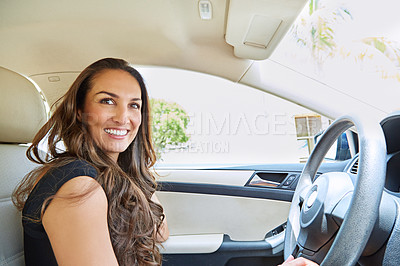 Buy stock photo Cropped shot of a young woman driving her car