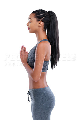 Buy stock photo Cropped shot of a female athlete meditating against a white background