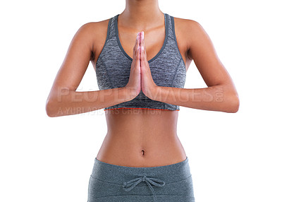 Buy stock photo Cropped shot of a female athlete meditating against a white background