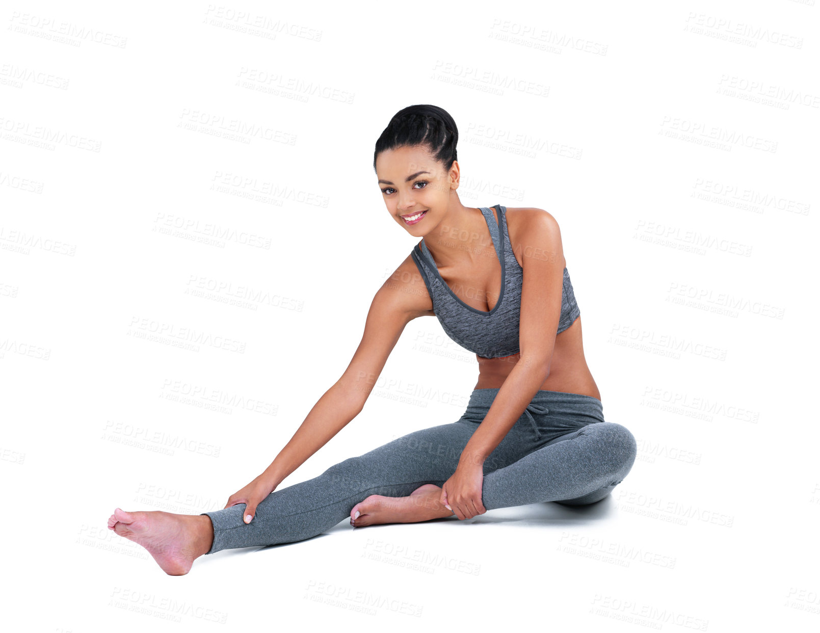 Buy stock photo Full length portrait of a female athlete stretching against a white background