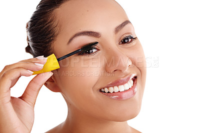 Buy stock photo Happy woman, makeup and beauty with mascara for cosmetics or cosmetology on a white studio background. Face of young female person or model with smile for facial treatment or volume on eyelashes