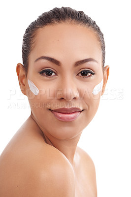 Buy stock photo Studio shot of a beautiful young woman with moisturizer on her skin