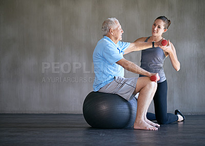 Buy stock photo Physiotherapist, dumbbells and smile of senior man on ball for fitness or rehabilitation at gym on mockup. Elderly person, weightlifting and personal trainer help for body health or physical therapy