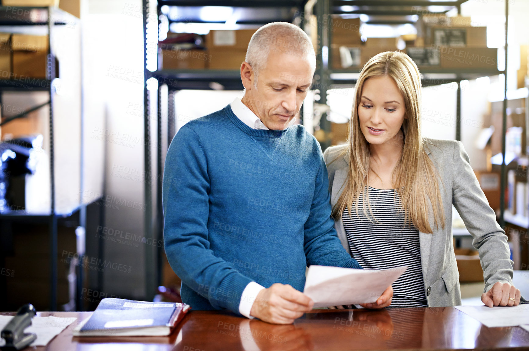 Buy stock photo Document, factory and team of business people in discussion for shipping, reading or distribution with senior manager. Warehouse, paperwork or logistics for inventory, stock or collaboration at table