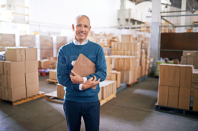 Buy stock photo Portrait of a mature man standing on the floor of a warehouse