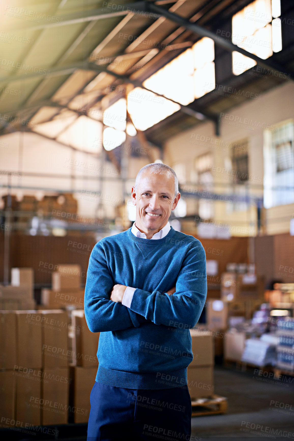 Buy stock photo Happy, arms crossed and portrait of man in warehouse for cargo, storage and shipping. Distribution, ecommerce and logistics with employee in factory for supply chain, package or wholesale supplier